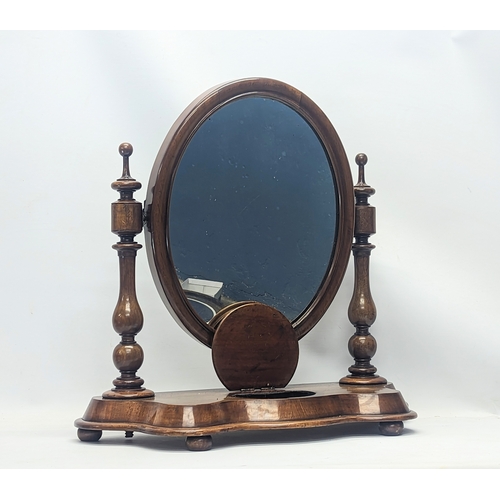 287 - A Victorian mahogany dressing mirror. 65x26x63cm