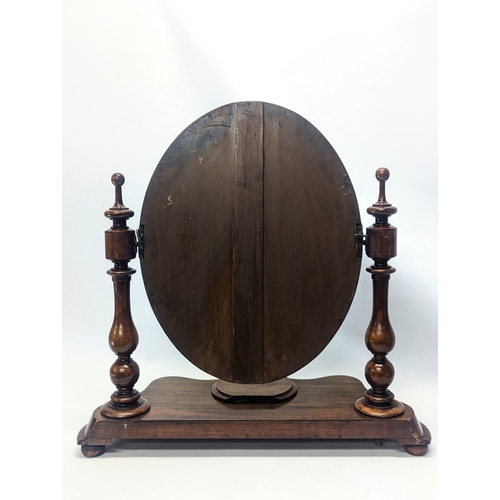 287 - A Victorian mahogany dressing mirror. 65x26x63cm