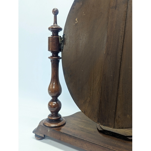 287 - A Victorian mahogany dressing mirror. 65x26x63cm