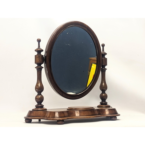 287 - A Victorian mahogany dressing mirror. 65x26x63cm