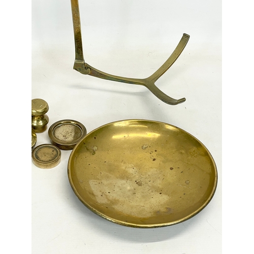 159 - A set of large Victorian brass and cast iron Class B balance scales with weights. 65x83cm