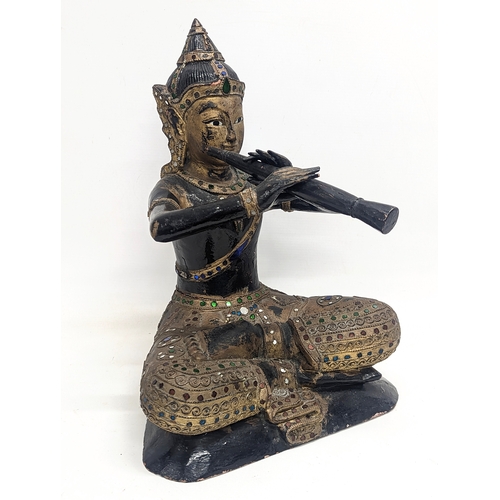 421 - A large late 19th / early 20th century carved wooden figure of Prince Phra Aphai Mani, a character o... 