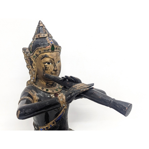 421 - A large late 19th / early 20th century carved wooden figure of Prince Phra Aphai Mani, a character o... 