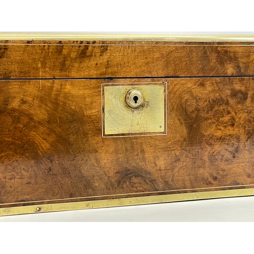 36 - A good quality early Victorian Walnut brass bound writing slope. 45.5x25x17.5cm closed.