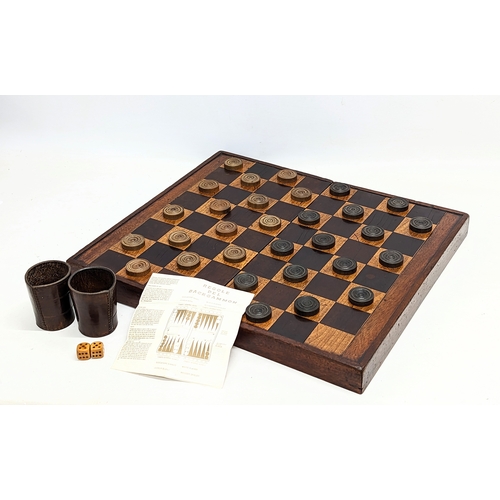 165 - An early 20th century mahogany draughts board with pieces. Board measures 51.5x45.5cm