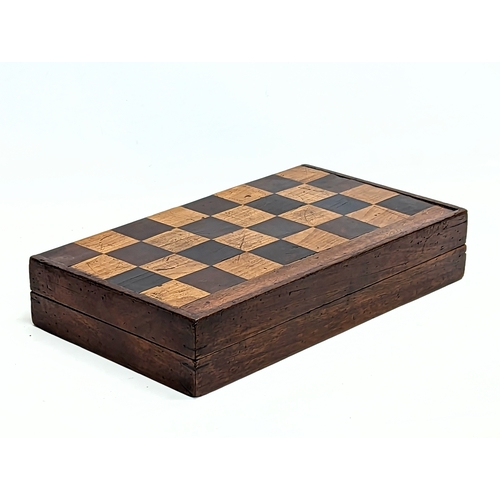 165 - An early 20th century mahogany draughts board with pieces. Board measures 51.5x45.5cm