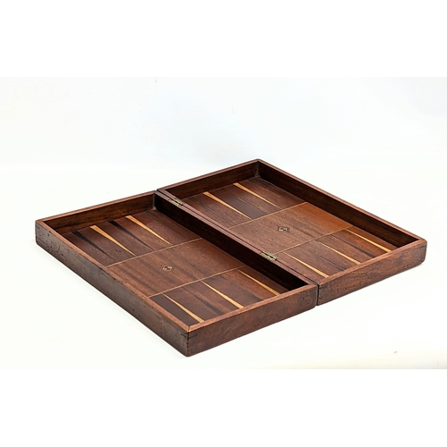 165 - An early 20th century mahogany draughts board with pieces. Board measures 51.5x45.5cm