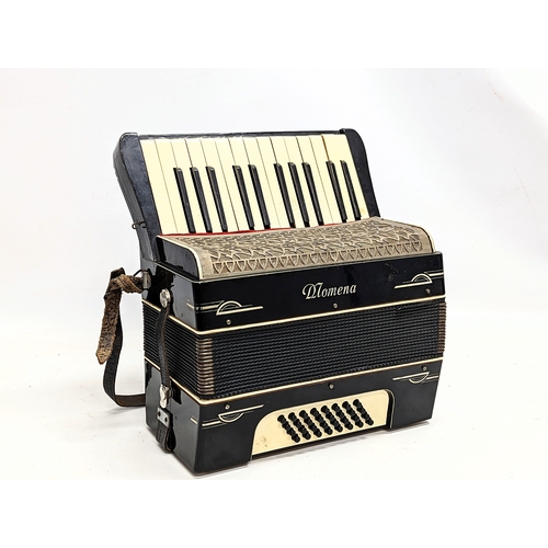 183 - A vintage Momena accordion in case.