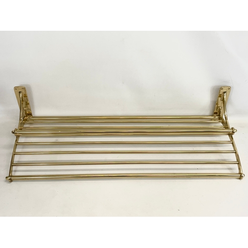 169 - A large heavy brass luggage rack. 100x40cm