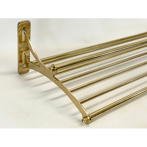 169 - A large heavy brass luggage rack. 100x40cm