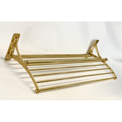 169 - A large heavy brass luggage rack. 100x40cm