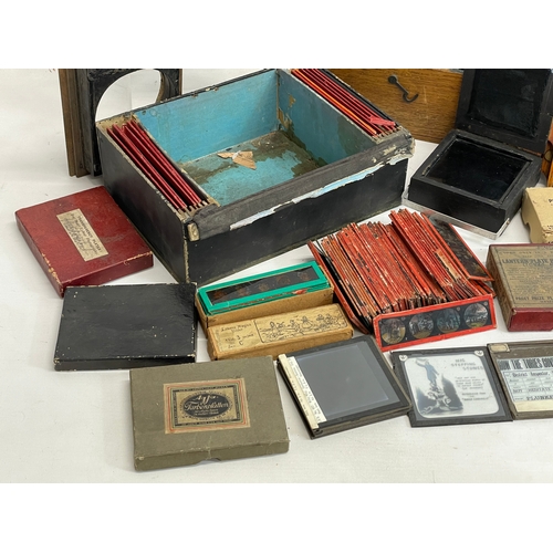 102 - A collection of early 20th century camera lantern plates and The Standard Magic Lantern in box.