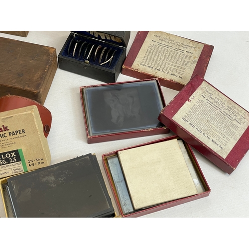 102 - A collection of early 20th century camera lantern plates and The Standard Magic Lantern in box.