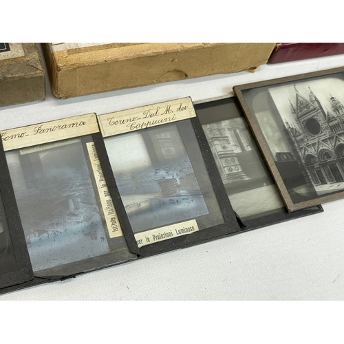 102 - A collection of early 20th century camera lantern plates and The Standard Magic Lantern in box.