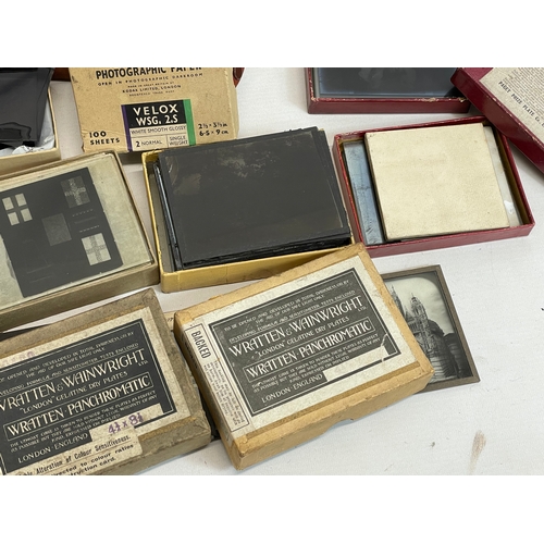 102 - A collection of early 20th century camera lantern plates and The Standard Magic Lantern in box.