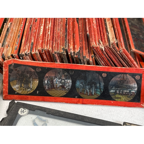 102 - A collection of early 20th century camera lantern plates and The Standard Magic Lantern in box.