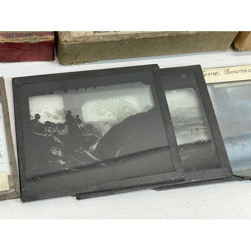 102 - A collection of early 20th century camera lantern plates and The Standard Magic Lantern in box.