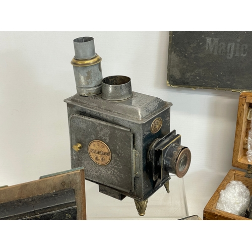 102 - A collection of early 20th century camera lantern plates and The Standard Magic Lantern in box.