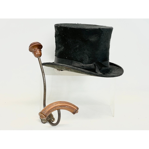 175 - A Christy’s of London top hat with an early 20th century wall stand.