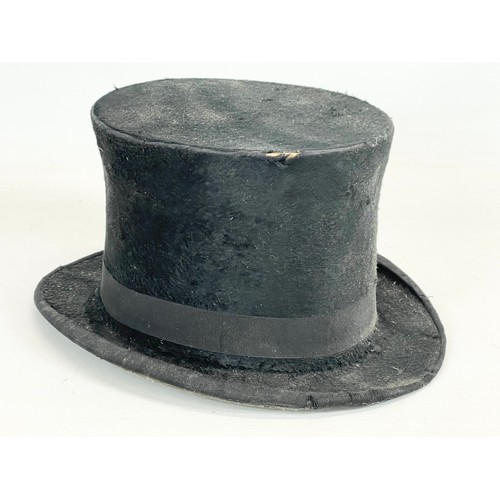 175 - A Christy’s of London top hat with an early 20th century wall stand.