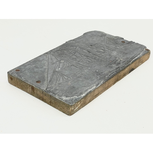 177 - A 19th century lead printing block on a ship. 22.5x12cm