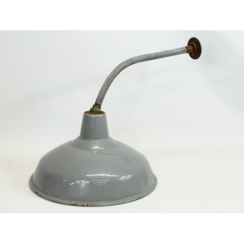 123 - A vintage industrial light fitting. 36x64cm