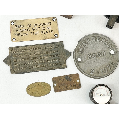 127 - A quantity of vintage gauges and brass signs.