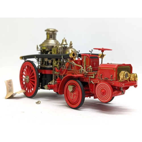 257 - A collectable model of The 1912 Christie Front Drive Steamer by Franklin Mint. 22x12.5cm