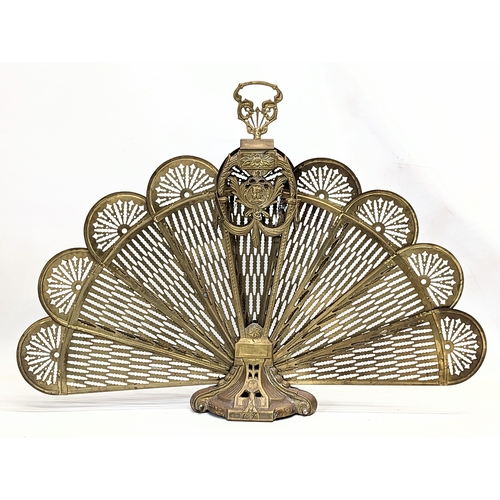 37 - A vintage brass peacock firescreen. 94.5x67.5cm when open.