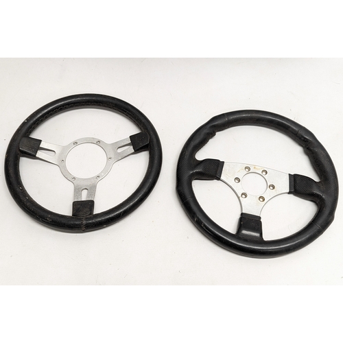 260E - 4 vintage race car steering wheels.