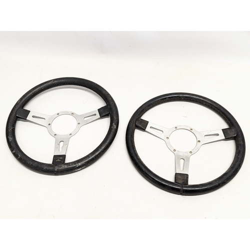 260E - 4 vintage race car steering wheels.