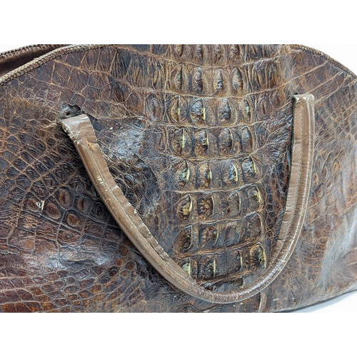 281C - 2 crocodile skin handbags. Largest measures 59x19x34cm