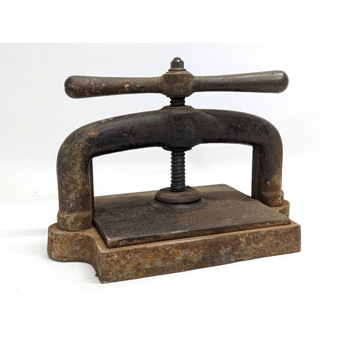 48 - An early 20th century cast iron book press.