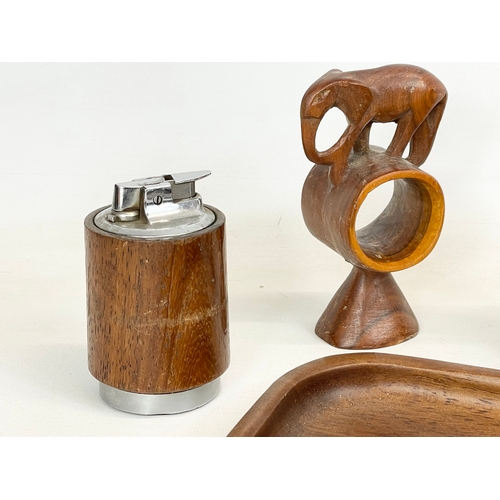 260V - A quantity of Mid Century teak. Including a tray 30.5cm, 4 napkin rings and a lighter.