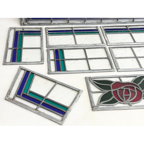 290B - A quantity of early 20th century stained glass panels. Largest 83x24.5cm