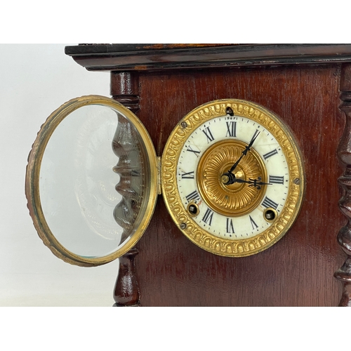 270C - A late 19th century American oak vases mantle clock, by Ansonia. With pendulum. 26x14x39cm