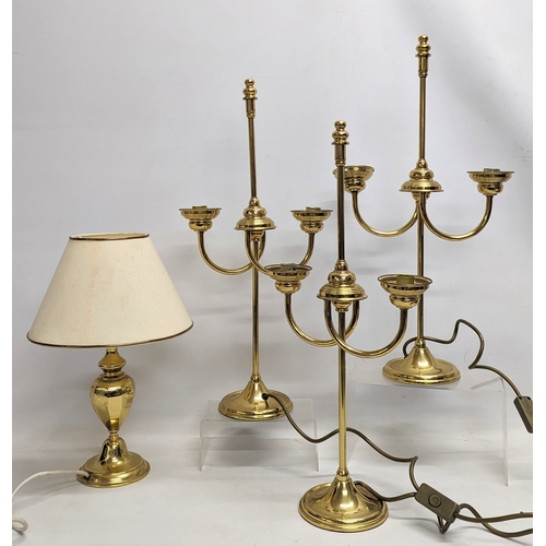 751 - A set of 3 brass table lamps in the form of candlesticks, with other brass table lamps. Tallest meas... 