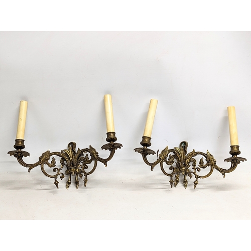 53 - A pair of early 20th century brass wall sconces.