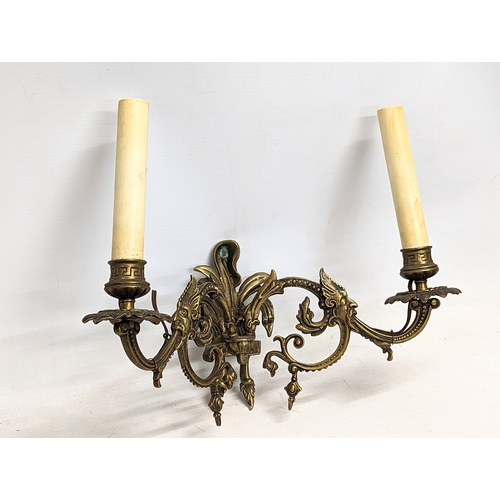 53 - A pair of early 20th century brass wall sconces.