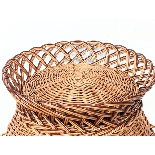 317 - A large good quality wicker linen hamper with handles and lid. 59cm