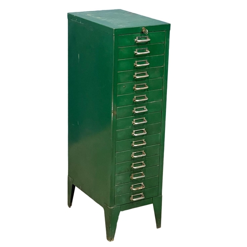 348 - A tall multi drawer filing chest with key. 29x39x99cm