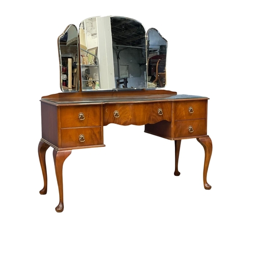 90 - A vintage mahogany Queen Anne style dressing table. 126x50x138cm