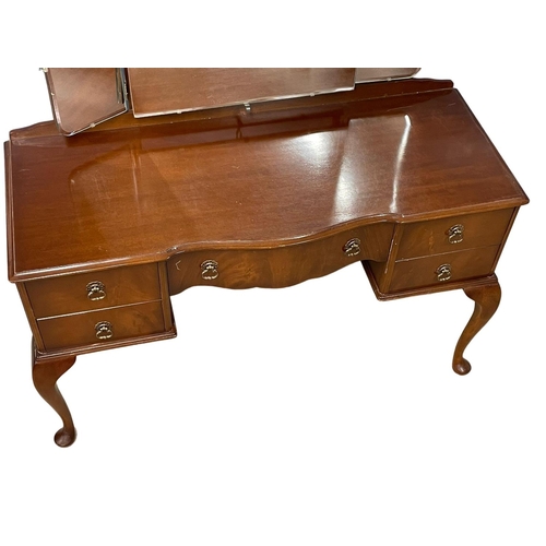 90 - A vintage mahogany Queen Anne style dressing table. 126x50x138cm