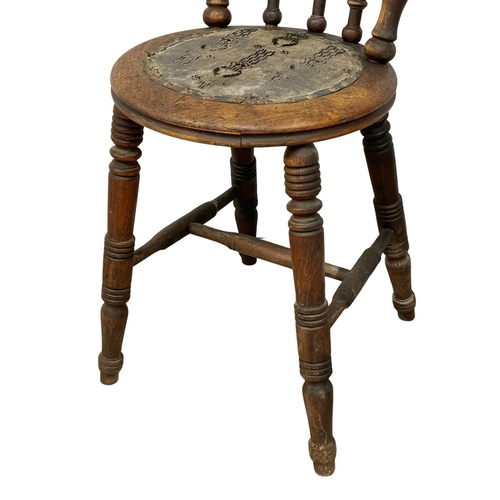 94 - A pair of Victorian Stick Back kitchen chairs. Circa 1890.