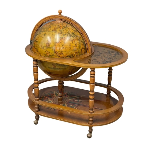 952 - A large drinks globe. 90x60x99cm