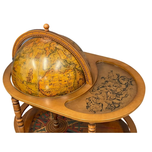 952 - A large drinks globe. 90x60x99cm