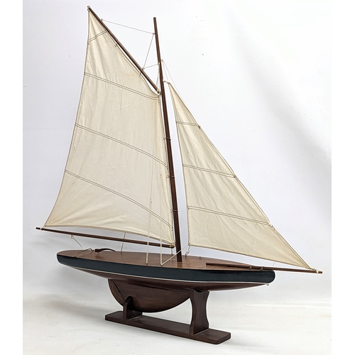 54 - A large vintage wooden yacht on stand. 96x92cm