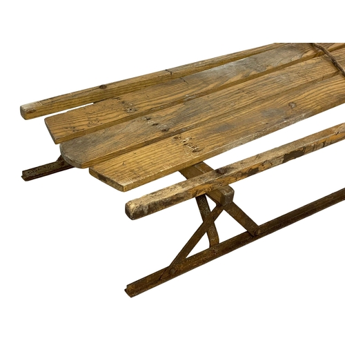 120A - An early 20th century wooden sleigh. 104cm