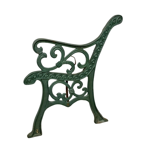 121 - A pair of large cast iron garden bench ends. 64x76cm