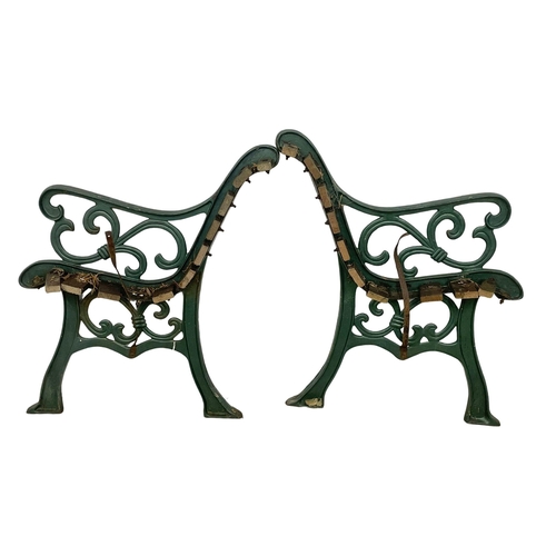 121 - A pair of large cast iron garden bench ends. 64x76cm